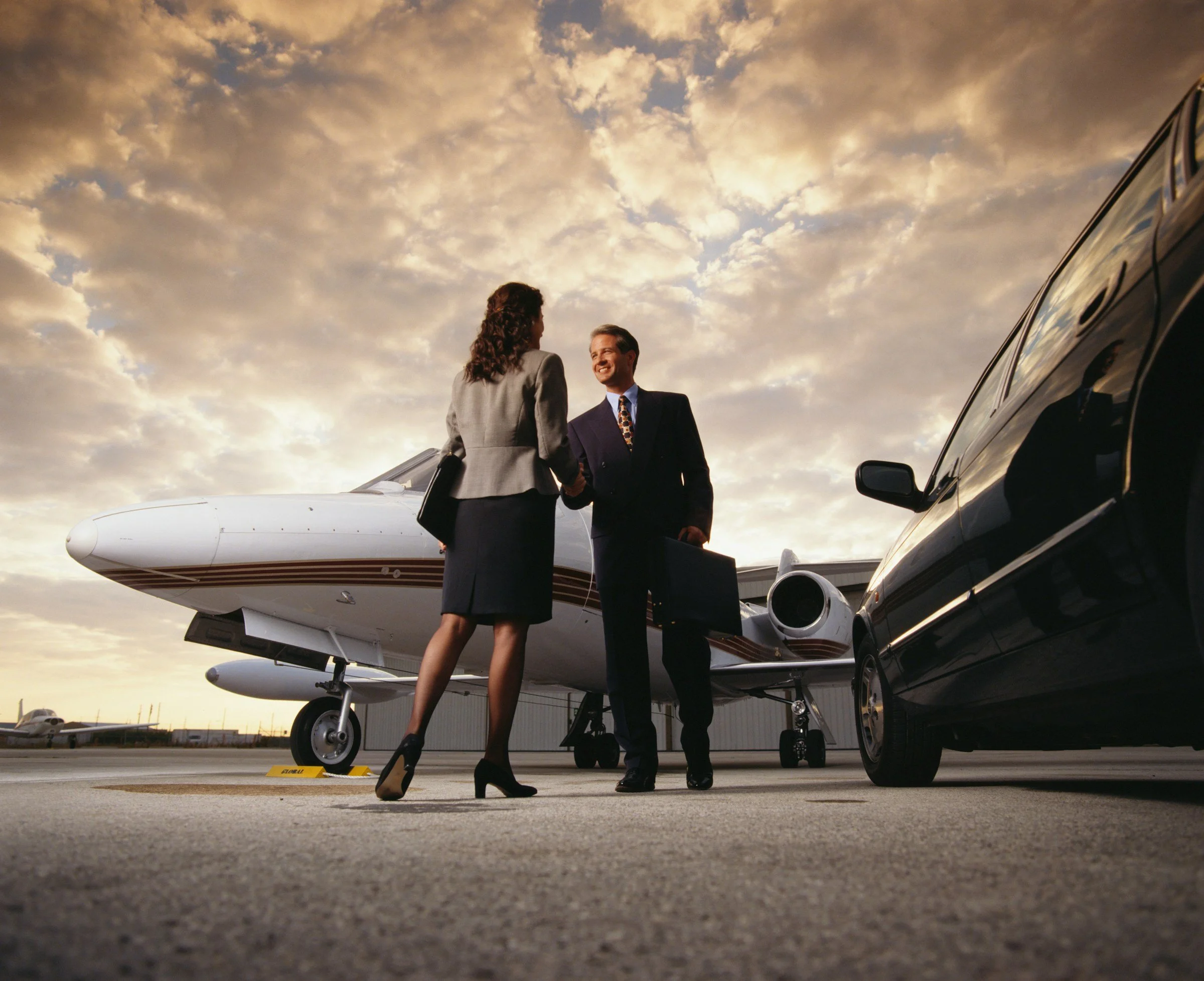 A closing handshake at a private aviation terminal